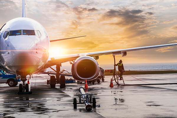 Servicing an airplane on the tarmac.